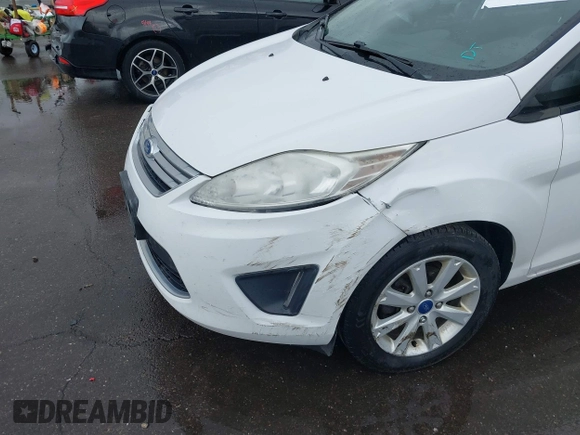 2012 Ford Fiesta SE with VIN 3FADP4BJ8CM102695, listed as a IAAI auction lot 41734833 with 131,779 mi miles. Bid and sale history available at carsss.com. Image 6.