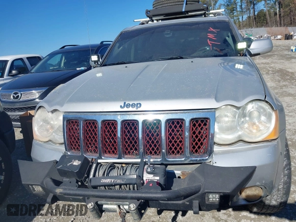 2009 Jeep Grand Cherokee with VIN 1J8HR68T39C540795, listed as a IAAI auction lot 41379112 with 236,624 mi miles and . Bid and sale history available at DreamBid. Image 12.