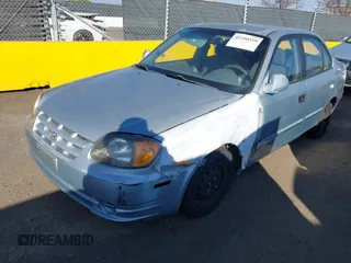 2004 Hyundai Accent GL with VIN KMHCG45C14U547954, listed as a IAAI auction lot 41350219 with 138,436 mi miles. Bid and sale history available at carsss.com. Image 2.