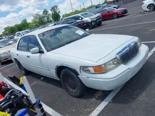 2001 Mercury Grand Marquis LS with VIN 2MEFM75W71X614856, listed as a IAAI auction lot 42195921 with 113,352 mi miles and . Bid and sale history available at DreamBid. Image 1.