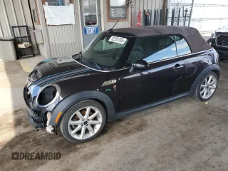 2014 MINI Convertible S with VIN WMWZP3C55ET706573, listed as a Copart auction lot 52325705 with 125,076 mi miles and Salvage Title. Bid and sale history available at DreamBid. Image 1.