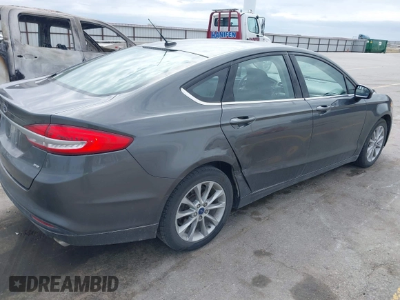 2017 Ford Fusion SE with VIN 3FA6P0H7XHR228922, listed as a IAAI auction lot 42162345 with 186,000 mi miles and . Bid and sale history available at DreamBid. Image 4.
