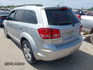2014 Dodge Journey SE with VIN 3C4PDCAB0ET284437, listed as a IAAI auction lot 42063601 with 206,913 mi miles and . Bid and sale history available at carsss.com. Image 3.