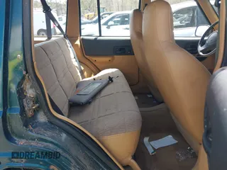 1998 Jeep Cherokee Sport with VIN 1J4FJ68S6WL151698, listed as a IAAI auction lot 42100846 with 239,466 mi miles. Bid and sale history available at carsss.com. Image 8.