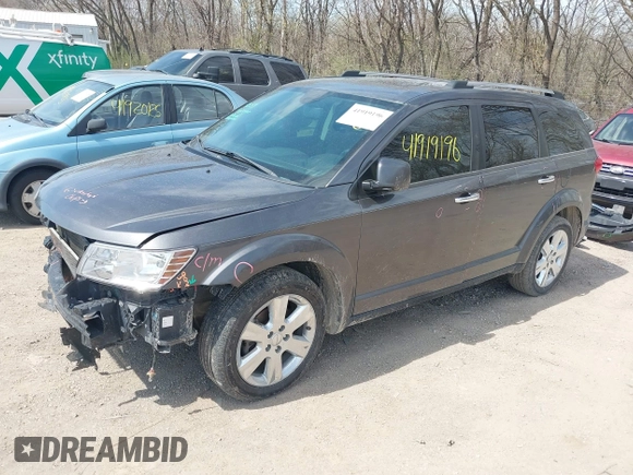 2014 Dodge Journey Limited with VIN 3C4PDDDG8ET199813, listed as a IAAI auction lot 41919196 with 199,096 mi miles and . Bid and sale history available at carsss.com. Image 2.