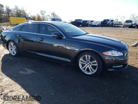 2015 Jaguar XJ Portfolio with VIN SAJWJ2GD1F8V77420, listed as a Copart auction lot 81786334 with 129,190 mi miles and Salvage title. Bid and sale history available at DreamBid. Image 4.