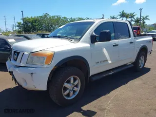 2010 Nissan Titan SE with VIN 1N6AA0EC1AN306419, listed as a IAAI auction lot 41658404 with 114,770 mi miles. Bid and sale history available at carsss.com. Image 2.