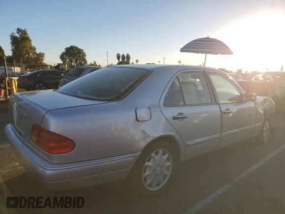 1999 Mercedes-Benz E 320 with VIN WDBJF65H8XA734585, listed as a Copart auction lot 79141194 with 196,908 mi miles and Salvage Title. Bid and sale history available at DreamBid. Image 3.