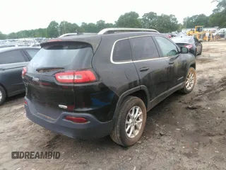 2014 Jeep Cherokee Latitude with VIN 1C4PJLCB1EW231178, listed as a IAAI auction lot 42128894 with 121,412 mi miles. Bid and sale history available at carsss.com. Image 4.