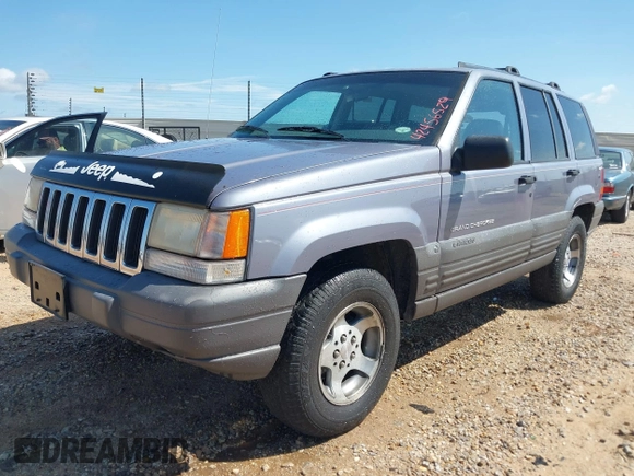 1996 Jeep Grand Cherokee with VIN 1J4EZ58S5TC149533, listed as a IAAI auction lot 42456529 with 173,872 mi miles and . Bid and sale history available at DreamBid. Image 2.