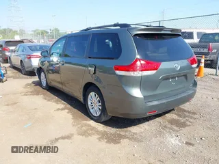 2014 Toyota Sienna XLE with VIN 5TDYK3DC6ES414892, listed as a IAAI auction lot 42545666 with 135,805 mi miles and . Bid and sale history available at DreamBid. Image 3.