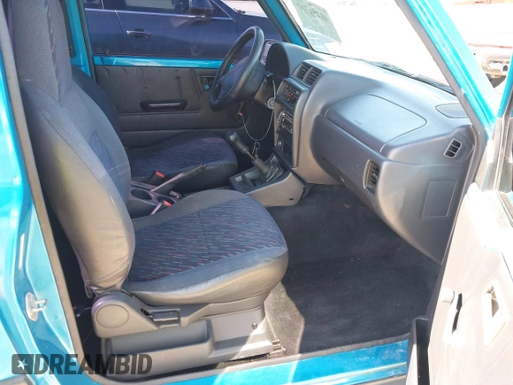1997 Chevrolet Tracker z VIN 2CNBE1865V6904672, wystawiony jako IAAI lot #41296166 z przebiegiem 266 743 mil mil oraz . Historia ofert i sprzedaży dostępna na DreamBid. Obrazek 5.