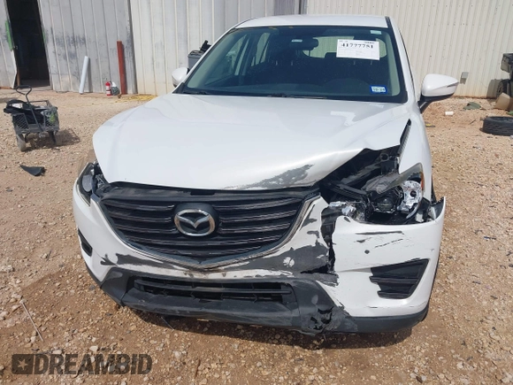 2016 Mazda CX-5 Sport with VIN JM3KE2BYXG0683318, listed as a IAAI auction lot 41777751 with 116,922 mi miles. Bid and sale history available at carsss.com. Image 6.