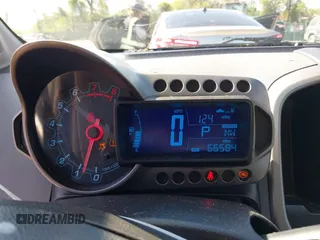2014 Chevrolet Sonic LS with VIN 1G1JA6SH3E4196824, listed as a IAAI auction lot 42099058 with 66,584 mi miles and . Bid and sale history available at DreamBid. Image 7.