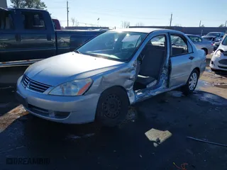2006 Mitsubishi Lancer ES with VIN JA3AJ26E06U057959, listed as a IAAI auction lot 41347649 with 122963 miles. Bid and sale history available at carsss.com. Image 18.