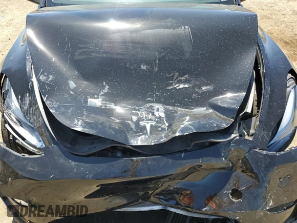 2024 Tesla Model Y Long Range with VIN 7SAYGAEE9RF125458, listed as a Copart auction lot 59567365 with 28,966 mi miles and Salvage title. Bid and sale history available at DreamBid. Image 12.