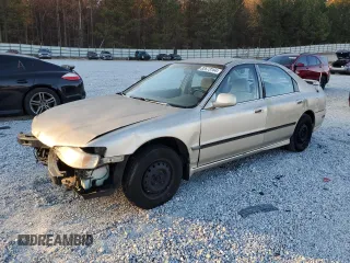 1994 Honda Accord LX with VIN 1HGCD5639RA165828, listed as a Copart auction lot 82673164 with 128,672 mi miles and Salvage Title. Bid and sale history available at carsss.com. Image 1.