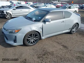 2014 Scion tC with VIN JTKJF5C71E3081033, listed as a IAAI auction lot 41928949 with 144,112 mi miles. Bid and sale history available at carsss.com. Image 18.