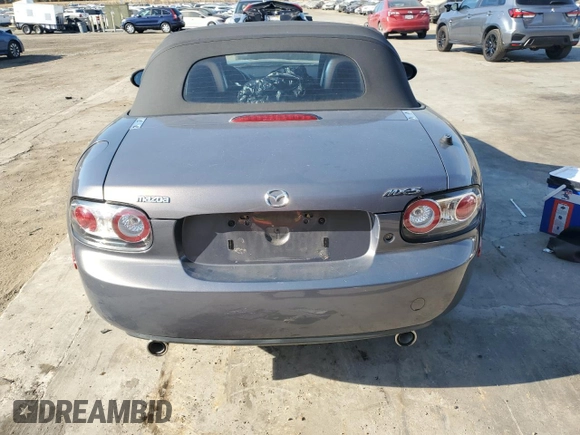 2006 Mazda MX-5 Miata Sport z VIN JM1NC25F260115830, wystawiony jako Copart lot #76844774 z przebiegiem 52 599 mil mil oraz Szkoda całkowita • Salvage title. Historia ofert i sprzedaży dostępna na DreamBid. Obrazek 6.