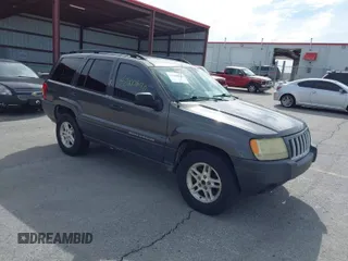 2004 Jeep Grand Cherokee Laredo with VIN 1J4GW48S64C144676, listed as a IAAI auction lot 42000690 with 218,256 mi miles. Bid and sale history available at carsss.com. Image 1.