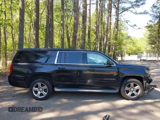 2015 Chevrolet Suburban LT with VIN 1GNSCJKC1FR264255, listed as a IAAI auction lot 42065176 with 115,861 mi miles. Bid and sale history available at carsss.com. Image 13.