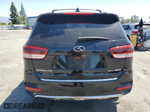 2016 Kia Sorento SXL z VIN 5XYPKDA19GG016449, wystawiony jako Copart lot #56943845 z przebiegiem 72 350 mil mil oraz Szkoda całkowita • Salvage title. Historia ofert i sprzedaży dostępna na DreamBid. Obrazek 6.
