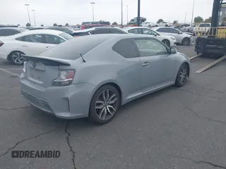 2014 Scion tC with VIN JTKJF5C71E3077886, listed as a IAAI auction lot 41939128 with 138,845 mi miles. Bid and sale history available at carsss.com. Image 4.