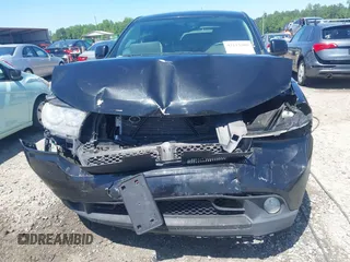 2013 Dodge Durango SXT with VIN 1C4RDJAG8DC617759, listed as a IAAI auction lot 42113300 with 185,152 mi miles and . Bid and sale history available at DreamBid. Image 12.