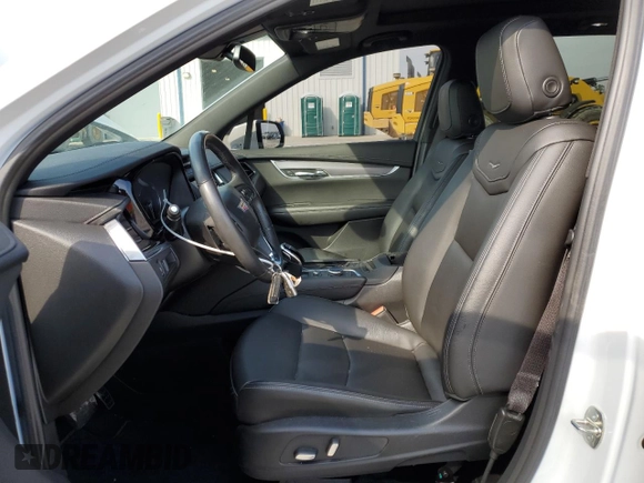 2024 Cadillac XT6 FWD Luxury with VIN 1GYKPAR47RZ705252, listed as a Copart auction lot 49244015 with 26,838 mi miles and Salvage title. Bid and sale history available at DreamBid. Image 7.
