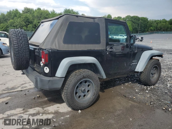 2011 Jeep Wrangler Sport z VIN 1J4GA2D16BL511735, wystawiony jako Copart lot #63292705 z przebiegiem 136 609 mil mil oraz Szkoda całkowita • Salvage title. Historia ofert i sprzedaży dostępna na DreamBid. Obrazek 3.