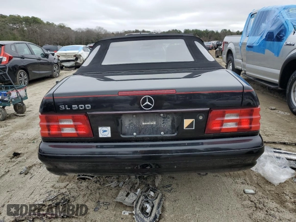 1999 Mercedes-Benz SL-Class with VIN WDBFA68F0XF184008, listed as a Copart auction lot 84998014 with 74,809 mi miles and Salvage Title. Bid and sale history available at carsss.com. Image 6.