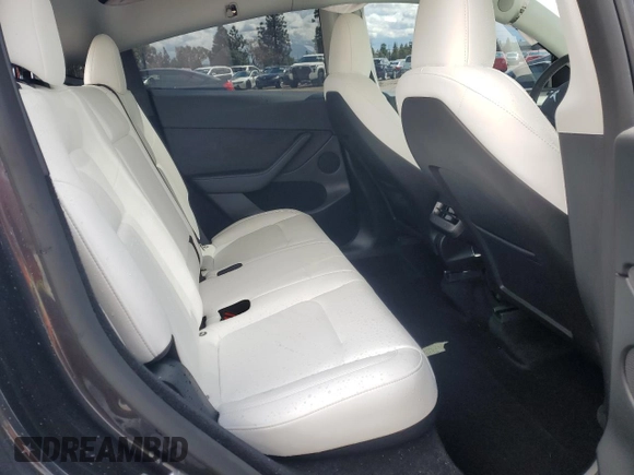 2024 Tesla Model Y z VIN 7SAYGDED1RF089192, wystawiony jako Copart lot #48752085 z przebiegiem 7 643 mil mil oraz Szkoda całkowita • Salvage title. Historia ofert i sprzedaży dostępna na DreamBid. Obrazek 11.