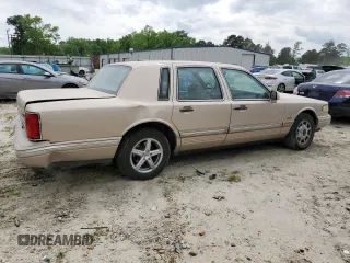 1997 Lincoln Town Car Signature z VIN 1LNLM82W8VY705599, wystawiony jako Copart lot #53096165 z przebiegiem 166 585 mil mil oraz Tytuł czysty. Historia ofert i sprzedaży dostępna na DreamBid. Obrazek 3.