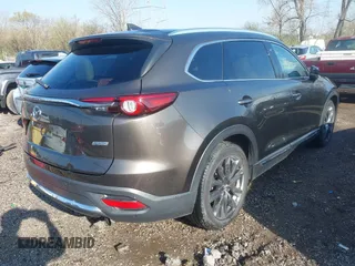 2016 Mazda CX-9 Grand Touring z VIN JM3TCBDY3G0104001, wystawiony jako IAAI lot #41961054 z przebiegiem 77 057 mil mil oraz . Historia ofert i sprzedaży dostępna na DreamBid. Obrazek 4.