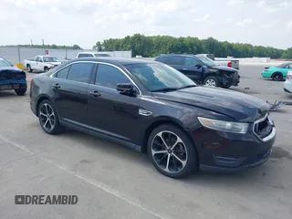 2014 Ford Taurus SEL z VIN 1FAHP2E87EG127065, wystawiony jako IAAI lot #42407270 z przebiegiem 135 599 mil mil oraz . Historia ofert i sprzedaży dostępna na DreamBid. Obrazek 1.