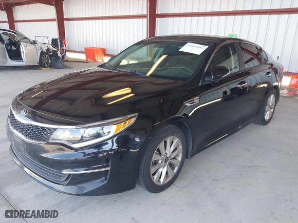 2016 Kia Optima LX with VIN 5XXGT4L33GG064125, listed as a IAAI auction lot 39506983 with 131,976 mi miles. Bid and sale history available at carsss.com. Image 2.