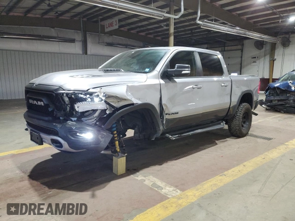 2022 Ram 1500 Rebel z VIN 1C6SRFLT1NN258780, wystawiony jako Copart lot #53040405 z przebiegiem 27 307 mil mil oraz Szkoda całkowita • Salvage title. Historia ofert i sprzedaży dostępna na DreamBid. Obrazek 1.