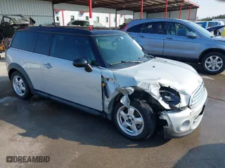 2011 MINI Cooper Clubman with VIN WMWZF3C59BT188367, listed as a IAAI auction lot 40755351 with 122,023 mi miles. Bid and sale history available at carsss.com. Image 1.
