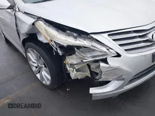 2014 Hyundai Azera Limited with VIN KMHFH4JG7EA388931, listed as a IAAI auction lot 41468407 with 130,597 mi miles and . Bid and sale history available at DreamBid. Image 6.