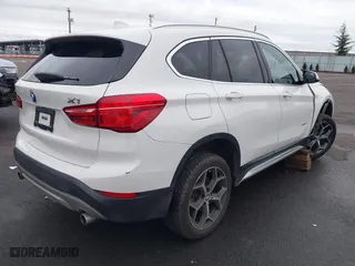 2018 BMW X1 sDrive28i with VIN WBXHU7C32J5H44246, listed as a IAAI auction lot 41477050 with 69,858 mi miles. Bid and sale history available at carsss.com. Image 4.