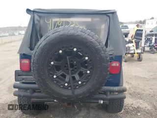 2003 Jeep Wrangler X with VIN 1J4FA39S23P300447, listed as a IAAI auction lot 41791733 with 165,576 mi miles. Bid and sale history available at carsss.com. Image 16.