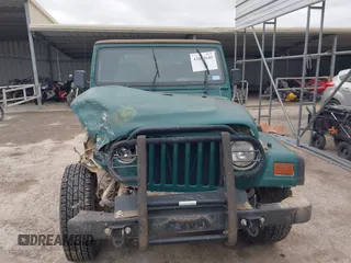 1997 Jeep Wrangler SE with VIN 1J4FY29P1VP408966, listed as a IAAI auction lot 41683640 with 106,910 mi miles. Bid and sale history available at carsss.com. Image 12.