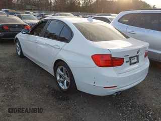 2014 BMW 3 Series 328i xDrive with VIN WBA3B5C52EF958635, listed as a IAAI auction lot 40916777 with 143,975 mi miles. Bid and sale history available at carsss.com. Image 3.