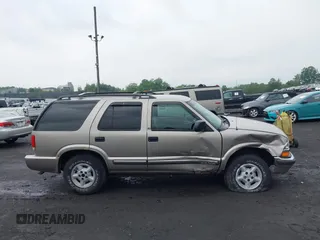 2000 Chevrolet Blazer LT with VIN 1GNDT13W9YK287456, listed as a IAAI auction lot 42450504 with 139,649 mi miles and . Bid and sale history available at DreamBid. Image 13.