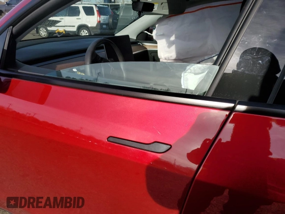 2024 Tesla Model Y Long Range with VIN 7SAYGAEEXRF056411, listed as a Copart auction lot 89218715 with Not Provided miles and Salvage Title. Bid and sale history available at DreamBid. Image 7.