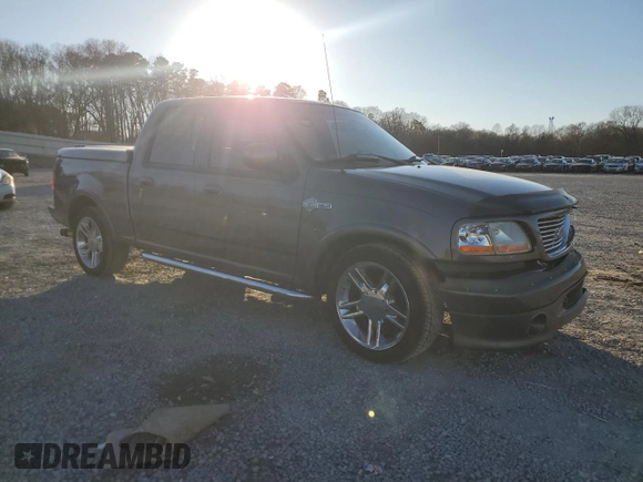 2002 Ford F-150 Harley Davidson with VIN 1FTRW07372KD29243, listed as a Copart auction lot 42972905 with 164,392 mi miles and Salvage Title. Bid and sale history available at carsss.com. Image 4.