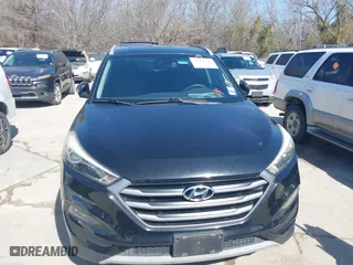 2017 Hyundai Tucson Value with VIN KM8J33A28HU302472, listed as a IAAI auction lot 41717598 with 126,438 mi miles. Bid and sale history available at carsss.com. Image 6.