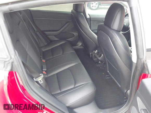 2023 Tesla Model 3 with VIN 5YJ3E1EA0PF455058, listed as a IAAI auction lot 42201618 with 31,147 mi miles and . Bid and sale history available at DreamBid. Image 8.