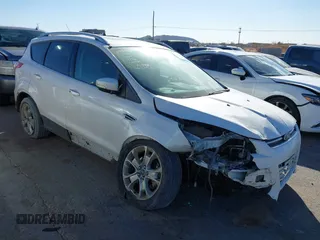 2016 Ford Escape Titanium with VIN 1FMCU0J96GUB36680, listed as a IAAI auction lot 41446705 with 137,926 mi miles. Bid and sale history available at carsss.com. Image 1.