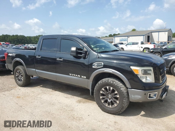 2016 Nissan Titan Platinum Reserve with VIN 1N6BA1F40GN512437, listed as a Copart auction lot 63521325 with 203,879 mi miles and Clean title. Bid and sale history available at DreamBid. Image 4.